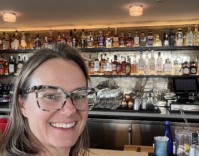 Monika with the completed Sunset Lounge feature wall