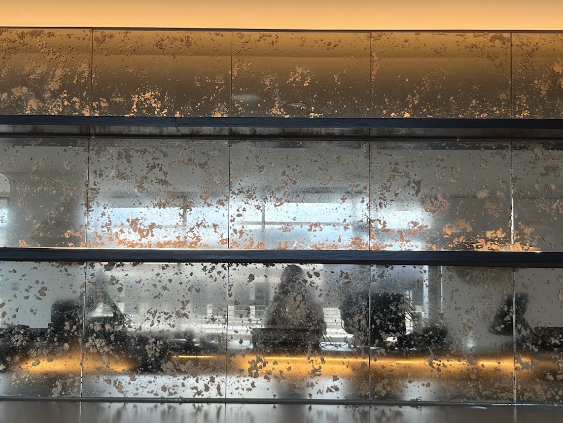 Close detail of the aged mirror finish
